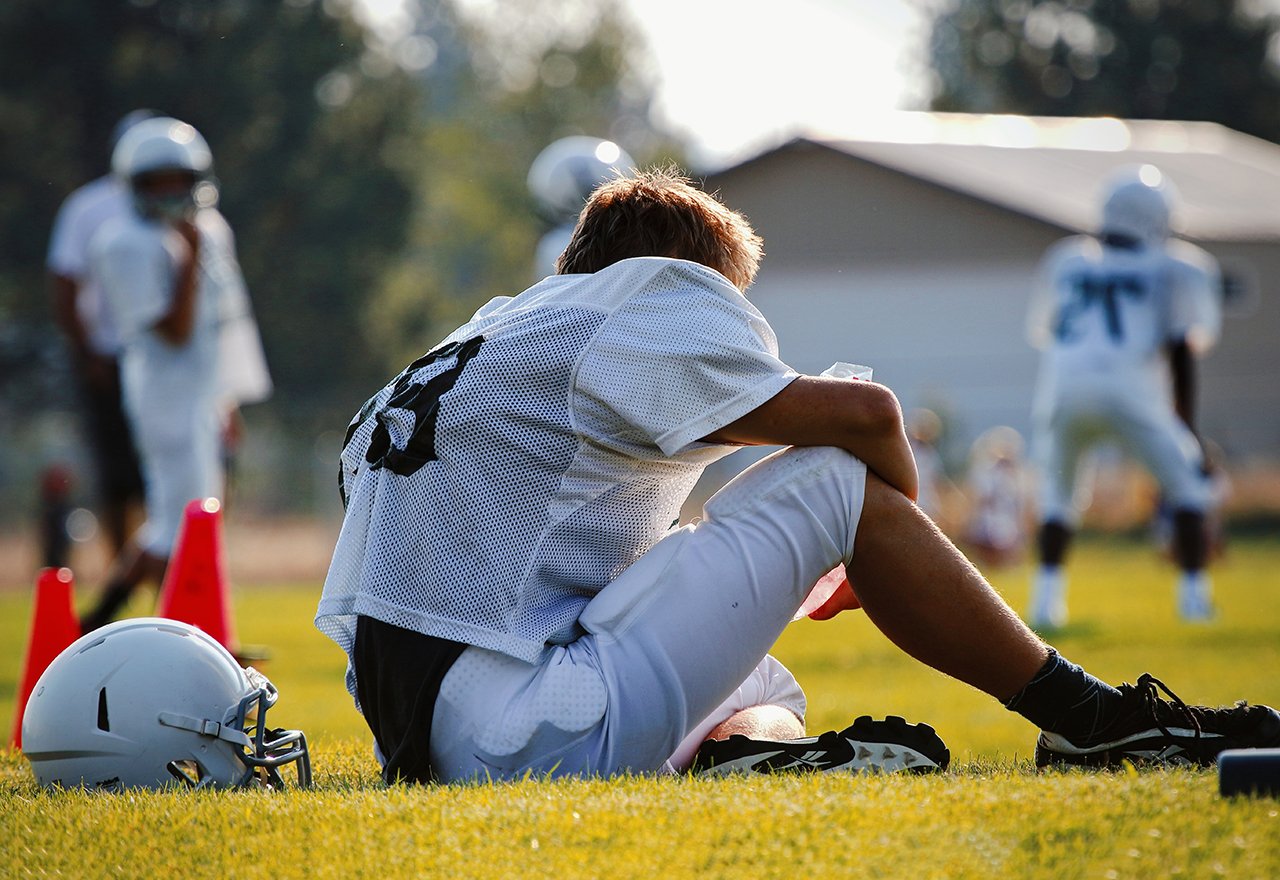Field Football Player Sitting