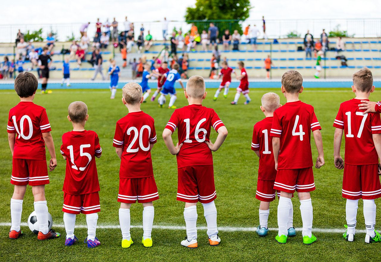 Kids Standing Soccer Field