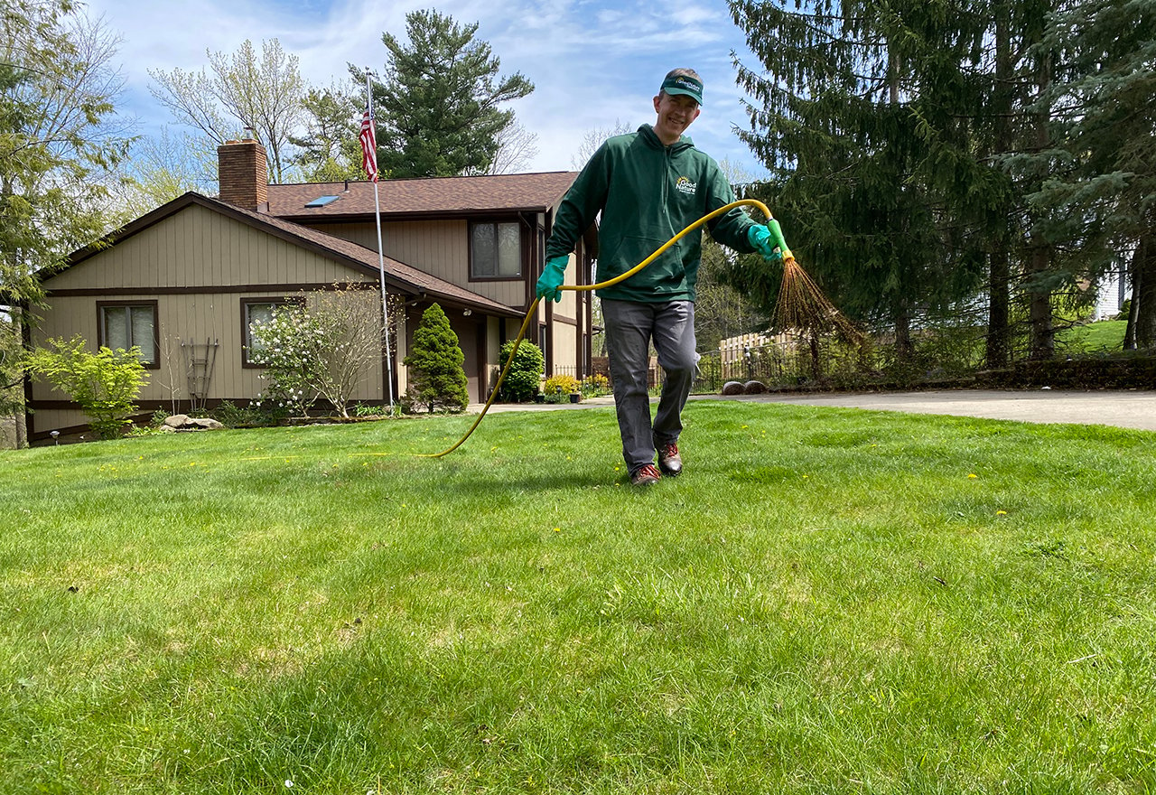 Technician Alex Spraying Lawn Smile